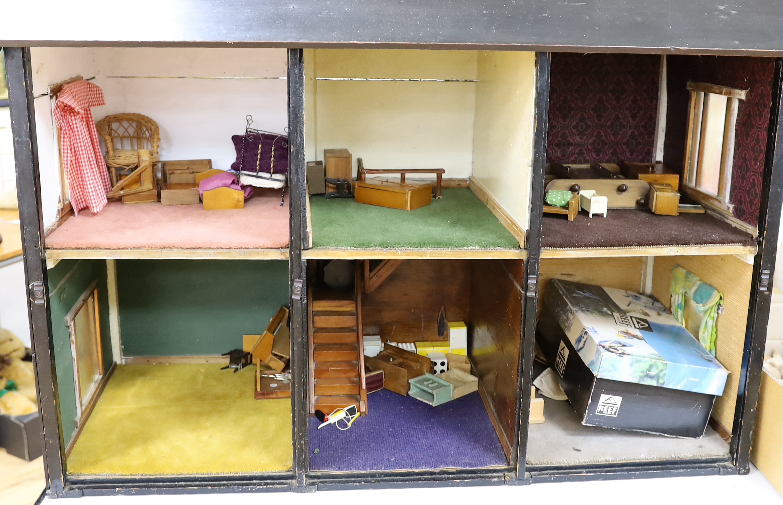 A large furnished English doll's house, circa 1900, presented as William Wordsworth's two floor Tudor-beamed cottage, 119cm x 103cm x 53cm